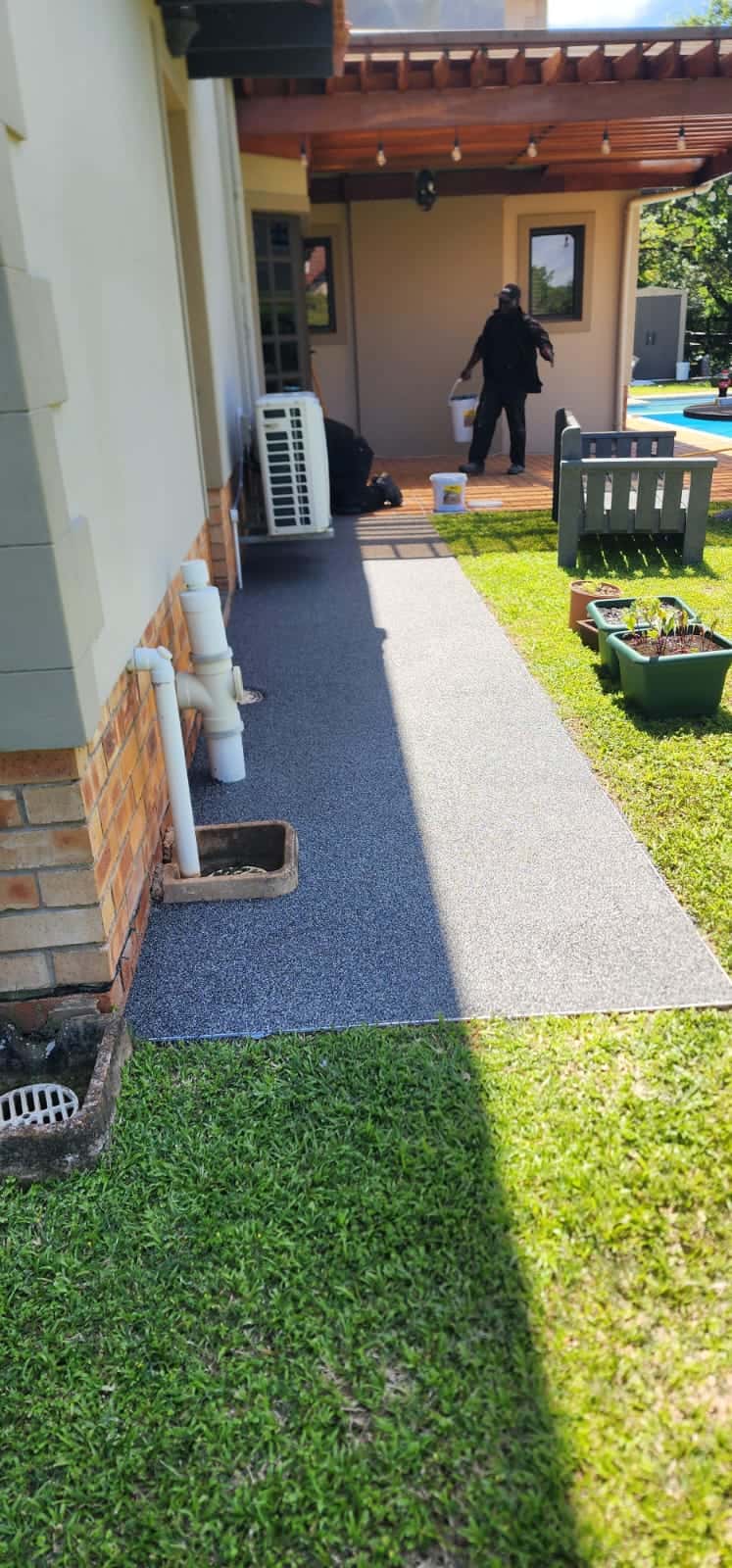 Grey and white pebbles around a home